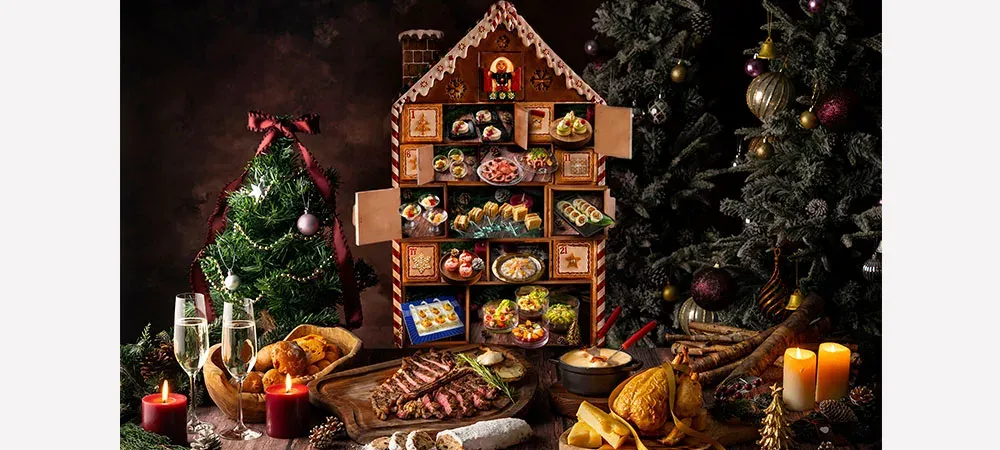 A festive lunch display with a gingerbread house and Christmas dishes at Cerise, Conrad Tokyo