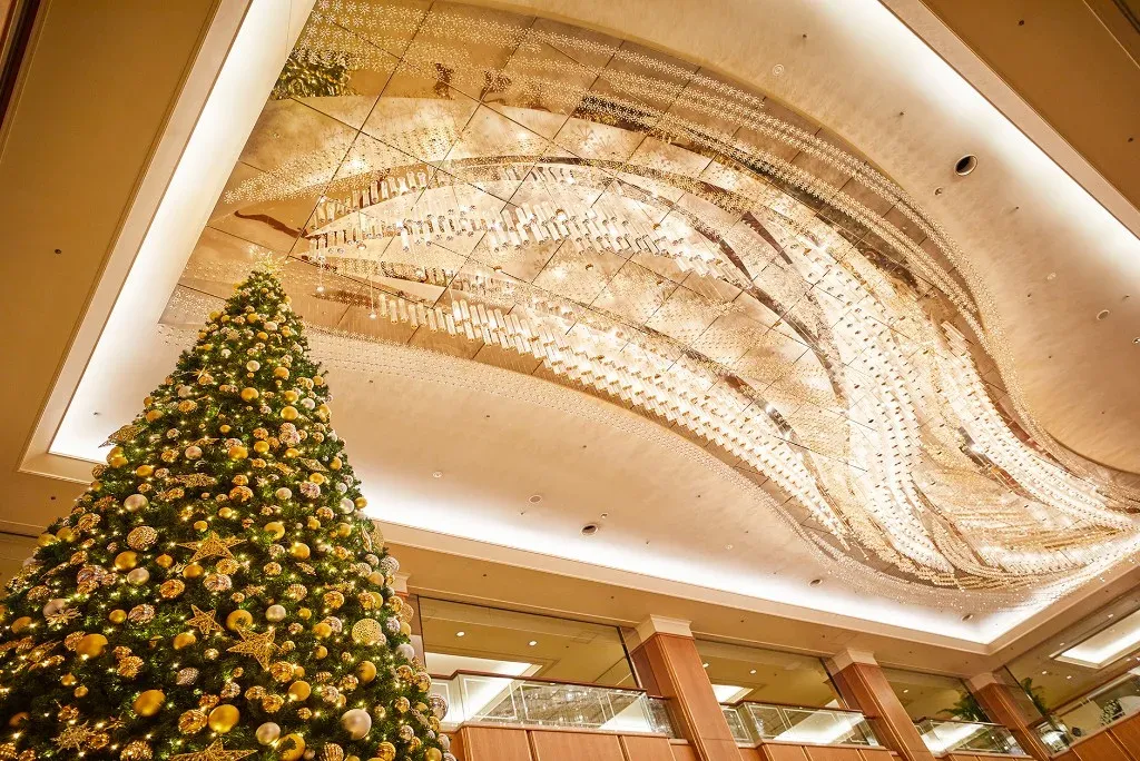 A Christmas tree beneath the lobby chandelier at Royal Park Hotel, Nihonbashi